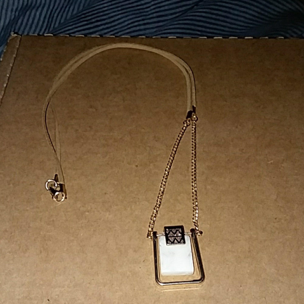 Gold trim and white ivory necklace